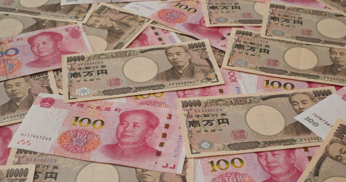 Stack of Chinese banknote and Japanese Yen